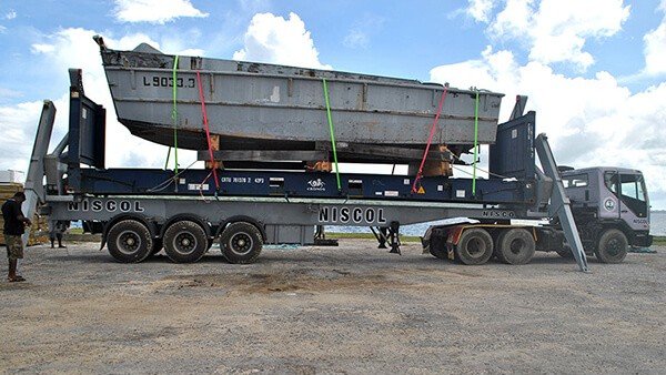 Landing craft L903.3 loaded onto a NISCOL truck for transport.