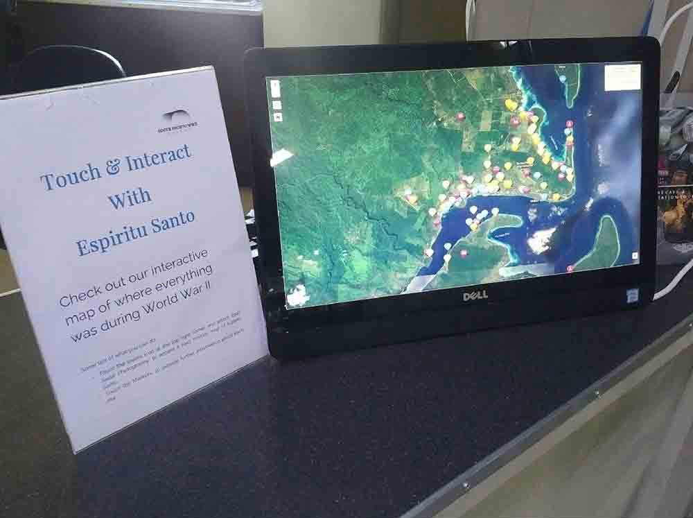 Interactive map of Espiritu Santo during WWII on Dell monitor with sign.