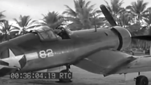 Vought F4U Corsair aircraft with number 82 on its side, parked outdoors.