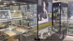 Museum display of vintage video equipment and historical photographs