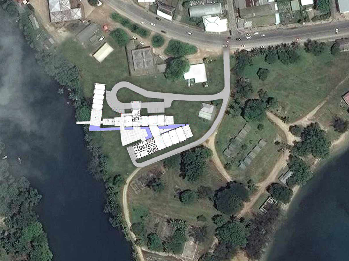 Aerial view of a modern building design overlayed on a waterfront location.